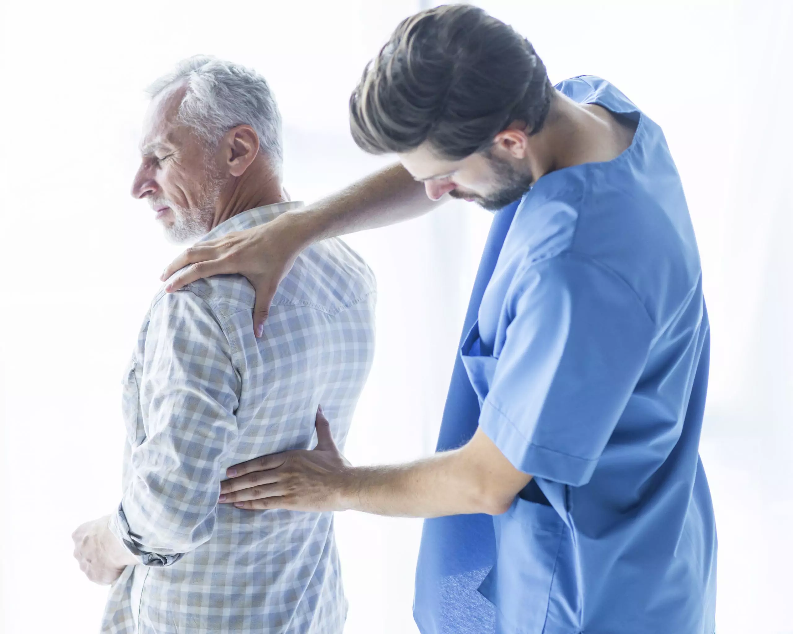 man experiencing back pain symptom of stage 4 kidney disease