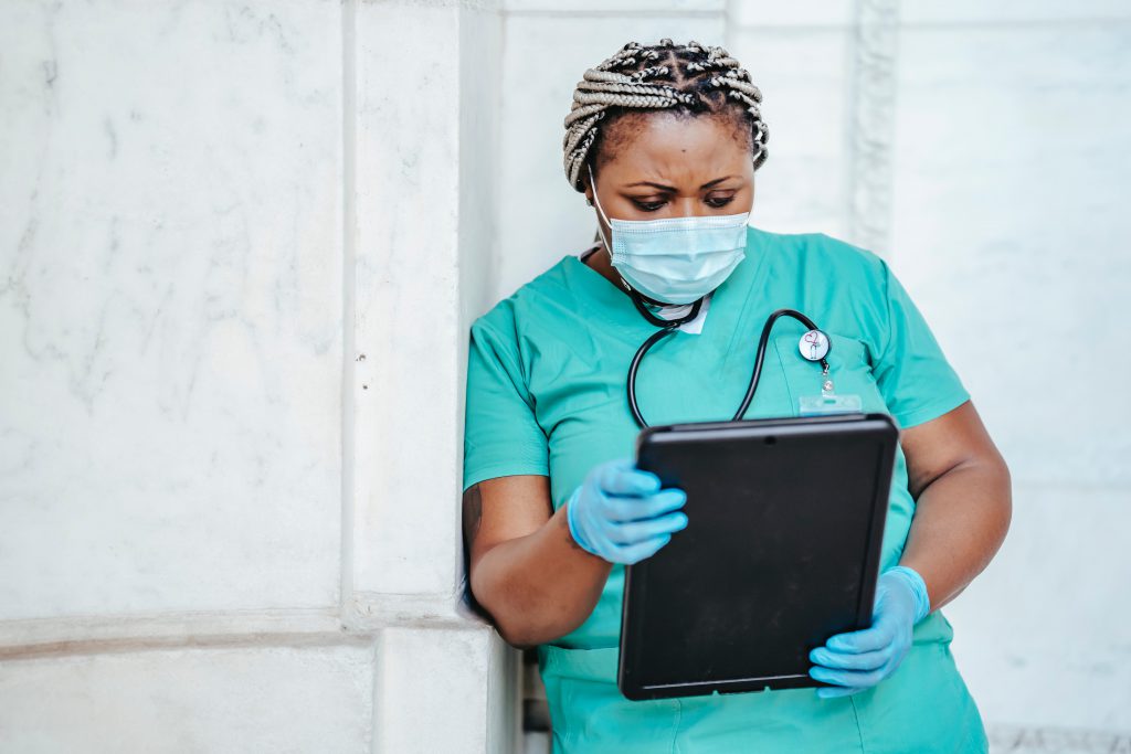 Doctor examines patient chart for COVID-19 lung damage